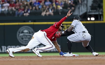 Aug 5, 2022; Arlington, Texas, USA;  Texas Rangers left fielder Bubba Thompson (65) steals second base ahead of the tag by Chicago White Sox second baseman Josh Harrison (5) during the second inning at Globe Life Field. Mandatory Credit: Kevin Jairaj-USA TODAY Sports