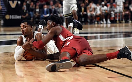 Jan 17, 2023; Nashville, Tennessee, USA; Vanderbilt Commodores guard Jordan Wright (4) dives for a ball against Alabama Crimson Tide guard Jaden Bradley (0) during the first half at Memorial Gymnasium. Mandatory Credit: Christopher Hanewinckel-USA TODAY Sports