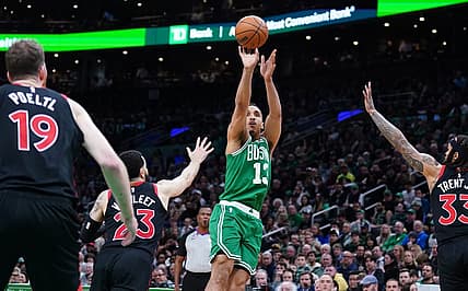 Apr 5, 2023; Boston, Massachusetts, USA; Boston Celtics guard Malcolm Brogdon (13) shoots the ball against Toronto Raptors guard Fred VanVleet (23) in the second half at TD Garden. Mandatory Credit: David Butler II-USA TODAY Sports