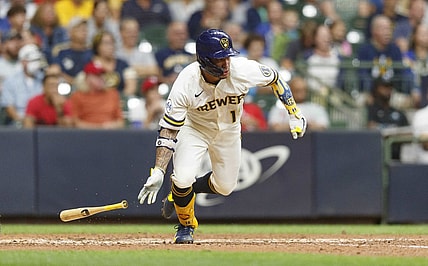 Sep 7, 2021; Milwaukee, Wisconsin, USA;  Milwaukee Brewers second baseman Kolten Wong (16) hits a two run single during the sixth inning against the Philadelphia Phillies at American Family Field. Mandatory Credit: Jeff Hanisch-USA TODAY Sports