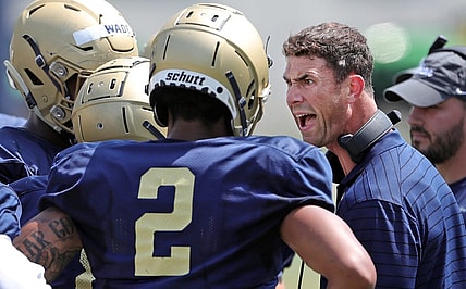 Akron Zips football coach Tom Arth gets members of his defense fired up during football practice, Saturday, Aug. 21, 2021, in Akron, Ohio.

Zipsfoot 2
