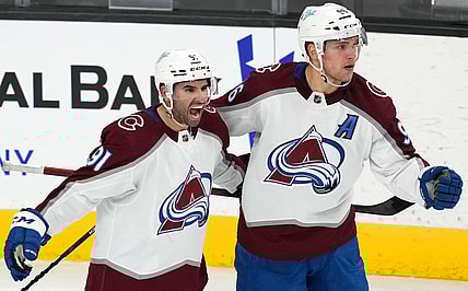 Feb 16, 2022; Las Vegas, Nevada, USA; Colorado Avalanche right wing Mikko Rantanen (96) celebrates with center Nazem Kadri (91) after scoring a power-play goal against the Vegas Golden Knights during the third period at T-Mobile Arena. Mandatory Credit: Stephen R. Sylvanie-USA TODAY Sports