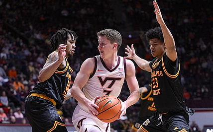Dec 17, 2022; Blacksburg, Virginia, USA; Virginia Tech Hokies guard Sean Pedulla (3) is double teamed by Grambling State Tigers guard Quintin Murrell (23) and Version Cotton in the second half at Cassell Coliseum. Mandatory Credit: Lee Luther Jr.-USA TODAY Sports