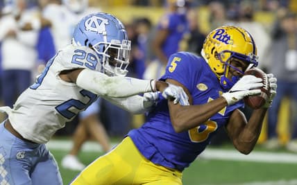 Nov 11, 2021; Pittsburgh, Pennsylvania, USA;  Pittsburgh Panthers wide receiver Jared Wayne (5) catches a thirty-two yard touchdown pass against North Carolina Tar Heels defensive back Storm Duck (29) during the second quarter at Heinz Field. Mandatory Credit: Charles LeClaire-USA TODAY Sports