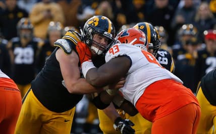 Iowa junior center Tyler Linderbaum battles Illinois junior defensive lineman Calvin Avery during a drive in the fourth quarter on Saturday, Nov. 20, 2021, at Kinnick Stadium in Iowa City, Iowa.

20211120 Iowavsillinois