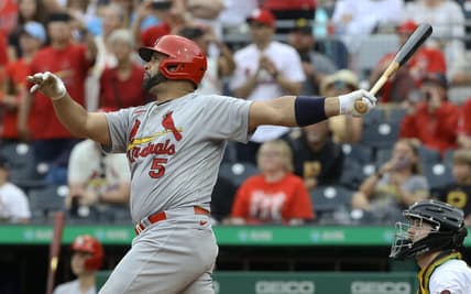 Sep 11, 2022; Pittsburgh, Pennsylvania, USA;  St. Louis Cardinals first baseman Albert Pujols (5) hits a two-run home run against the Pittsburgh Pirates during the ninth inning at PNC Park. The home run is the 697th home run of Pujols' career giving him sole possession of fourth place all time on the MLB career home run list. The Cardinals won 4-3. Mandatory Credit: Charles LeClaire-USA TODAY Sports