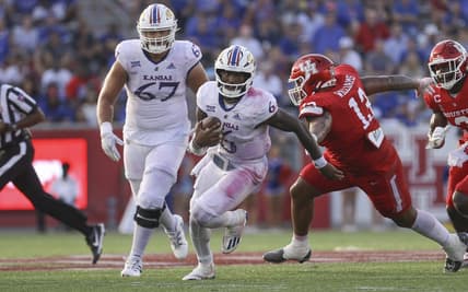 Sep 17, 2022; Houston, Texas, USA; Kansas Jayhawks quarterback Jalon Daniels (6) runs with the ball during the third quarter against the Houston Cougars at TDECU Stadium. Mandatory Credit: Troy Taormina-USA TODAY Sports