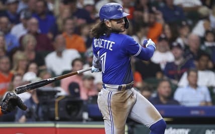 Apr 18, 2023; Houston, Texas, USA; Toronto Blue Jays shortstop Bo Bichette (11) hits an RBI single during the fifth inning against the Houston Astros at Minute Maid Park. Mandatory Credit: Troy Taormina-USA TODAY Sports