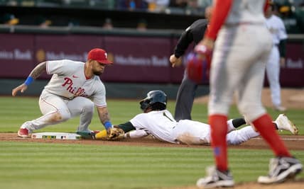 Jun 16, 2023; Oakland, California, USA; Oakland Athletics center fielder Esteury Ruiz (1) steals third base ahead of the tag by Philadelphia Phillies third baseman Edmundo Sosa (33) during the sixth inning at Oakland-Alameda County Coliseum. Mandatory Credit: D. Ross Cameron-USA TODAY Sports