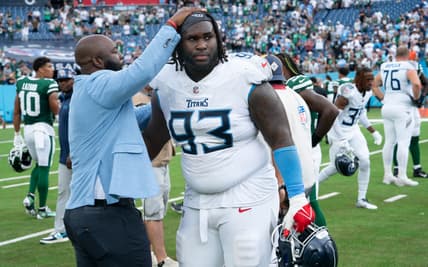 Tennessee Titans General Manager Ran Carthon greets Tennessee Titans defensive tackle T'Vondre Sweat (93) after their 24-17 loss