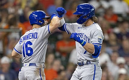 Jul 5, 2022; Houston, Texas, USA; Kansas City Royals left fielder Andrew Benintendi (16) celebrates shortstop Bobby Witt Jr. (7) two run home run against the Houston Astros in the third  inning at Minute Maid Park. Mandatory Credit: Thomas Shea-USA TODAY Sports