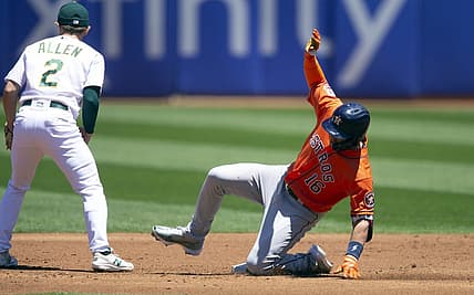 Jul 9, 2022; Oakland, California, USA; Houston Astros designated hitter Aledmys D  az (16) slides safely into second base while Oakland Athletics second baseman Nick Allen (2) waits for the late relay during the second inning at RingCentral Coliseum. Mandatory Credit: D. Ross Cameron-USA TODAY Sports