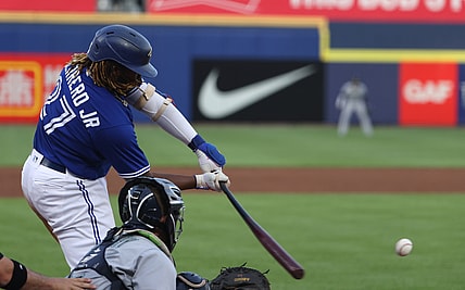 Jun 29, 2021; Buffalo, New York, USA;  Toronto Blue Jays first baseman Vladimir Guerrero Jr. (27) gets a base hit during the third inning against the Seattle Mariners at Sahlen Field. Mandatory Credit: Timothy T. Ludwig-USA TODAY Sports
