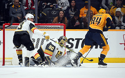 Nov 24, 2021; Nashville, Tennessee, USA; Vegas Golden Knights goalie Robin Lehner (90) makes a save on a shot attempt from Nashville Predators left wing Tanner Jeannot (84) during the second period at Bridgestone Arena. Mandatory Credit: Christopher Hanewinckel-USA TODAY Sports