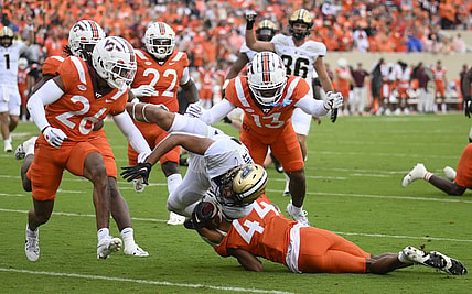 Sep 9, 2023; Blacksburg, Virginia, USA; Virginia Tech Hokies cornerback Dorian Strong (44) attempts to tackle Purdue Boilermakers running back Devin Mockobee (45) but he could not stop the dive into the end zone in the first quarter at Lane Stadium. Mandatory Credit: Lee Luther Jr.-USA TODAY Sports