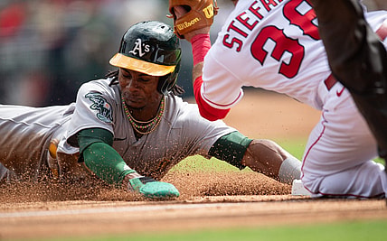 Oct 1, 2023; Anaheim, California, USA; Oakland Athletics right fielder Esteury Ruiz (1) steals second base against Los Angeles Angels second baseman Michael Stefanic (38) during the third inning at Angel Stadium. Mandatory Credit: Jonathan Hui-USA TODAY Sports