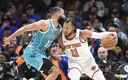 Jan 29, 2024; Charlotte, North Carolina, USA;  New York Knicks guard Jalen Brunson (11) moves into Charlotte Hornets forward Cody Martin (11) during the second half at the Spectrum Center. Mandatory Credit: Sam Sharpe-USA TODAY Sports