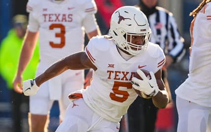 Nov 19, 2022; Lawrence, Kansas, USA; Texas Longhorns running back Bijan Robinson (5) runs the ball during the first half against the Kansas Jayhawks at David Booth Kansas Memorial Stadium. Mandatory Credit: Jay Biggerstaff-USA TODAY Sports