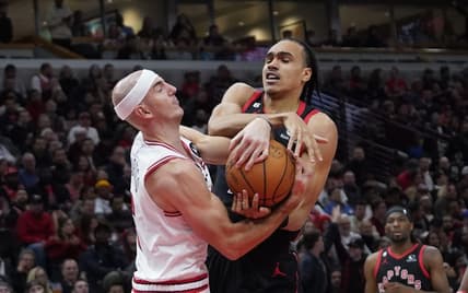 Nov 7, 2022; Chicago, Illinois, USA; Toronto Raptors guard Dalano Banton (45) and Chicago Bulls guard Alex Caruso (6) go for the ball during the second half at United Center. Mandatory Credit: David Banks-USA TODAY Sports