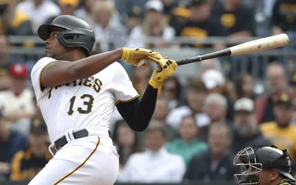 May 20, 2023; Pittsburgh, Pennsylvania, USA;  Pittsburgh Pirates third baseman Ke'Bryan Hayes (13) hits a three run triple against the Arizona Diamondbacks during the third inning at PNC Park. Mandatory Credit: Charles LeClaire-USA TODAY Sports