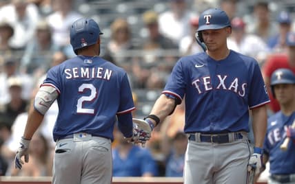 May 24, 2023; Pittsburgh, Pennsylvania, USA; Texas Rangers designated hitter Corey Seager (right) greets second baseman Marcus Semien (2) after hitting a solo home run against the Pittsburgh Pirates during the first inning at PNC Park. Mandatory Credit: Charles LeClaire-USA TODAY Sports