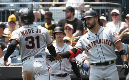 Jul 16, 2023; Pittsburgh, Pennsylvania, USA; San Francisco Giants right fielder Michael Conforto (8) greets first baseman LaMonte Wade Jr. (31) crossing home plate to score a run against the Pittsburgh Pirates during the third inning at PNC Park. Mandatory Credit: Charles LeClaire-USA TODAY Sports