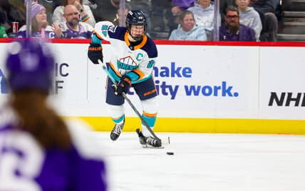 New York Sirens captain Micah Zandee-Hart carries the puck against the Minnesota Frost.