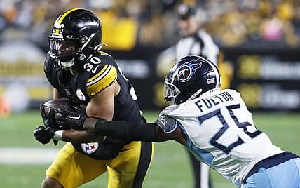Nov 2, 2023; Pittsburgh, Pennsylvania, USA;  Pittsburgh Steelers running back Jaylen Warren (30) runs against Tennessee Titans cornerback Kristian Fulton (26) during the third quarter at Acrisure Stadium. Pittsburgh won 20-16. Mandatory Credit: Charles LeClaire-USA TODAY Sports