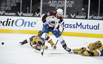 Apr 28, 2021; Las Vegas, Nevada, USA;  Vegas Golden Knights goaltender Marc-Andre Fleury (29) knocks the puck away from Colorado Avalanche center Liam O'Brien (38) during the first period at T-Mobile Arena. Mandatory Credit:  John Locher/POOL PHOTOS-USA TODAY Sports