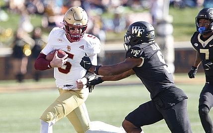 Oct 22, 2022; Winston-Salem, North Carolina, USA; Wake Forest Demon Deacons defensive back Chelen Garnes (9) moves in against Boston College Eagles quarterback Phil Jurkovec (5) out of bounds an a quarterback keeper  during the first quarter at Truist Field. Mandatory Credit: Reinhold Matay-USA TODAY Sports