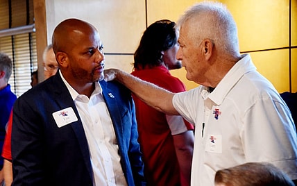 Louisiana Tech athletic director Eric Wood gets some advice from Curt Joiner during Tuesday's Bulldog Blitz at Shreveport's Cantina Laredo.