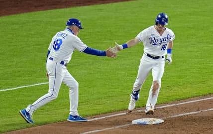 Jun 1, 2021; Kansas City, Missouri, USA; Kansas City Royals left fielder Andrew Benintendi (16) is congratulated by first base coach Rusty Kuntz (18) after hitting a grand slam against the Pittsburgh Pirates during the fifth inning at Kauffman Stadium. Mandatory Credit: Jay Biggerstaff-USA TODAY Sports