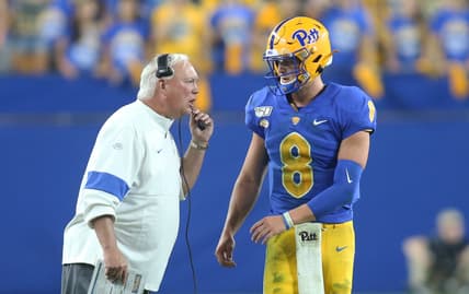 Aug 31, 2019; Pittsburgh, PA, USA;  Pittsburgh Panthers offensive coordinator Mark Whipple (left) talks with quarterback Kenny Pickett (8) the Virginia Cavaliers during the fourth quarter at Heinz Field. Virginia won 30-14. Mandatory Credit: Charles LeClaire-USA TODAY Sports