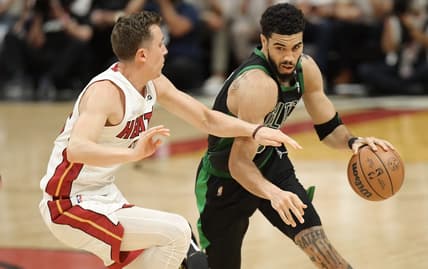 May 25, 2022; Miami, Florida, USA; Boston Celtics forward Jayson Tatum (0) drives to the basket against Miami Heat guard Duncan Robinson (55) during the second half of game five of the 2022 eastern conference finals at FTX Arena. Mandatory Credit: Jim Rassol-USA TODAY Sports