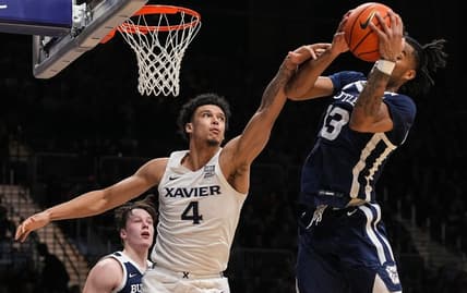 Xavier Musketeers forward Cesare Edwards (4) reaches for the ball against Butler Bulldogs guard Jayden Taylor (13) on Friday, Feb. 10, 2023 at Hinkle Fieldhouse in Indianapolis. The Butler Bulldogs defeated the Xavier Musketeers, 69-67.

Ncaa Basketball Butler Xavier Hoops Xavier Musketeers At Butler Bulldogs