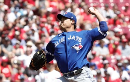 Aug 20, 2023; Cincinnati, Ohio, USA; Toronto Blue Jays starting pitcher Hyun Jin Ryu (99) throws against the Cincinnati Reds during the first inning at Great American Ball Park. Mandatory Credit: David Kohl-USA TODAY Sports
