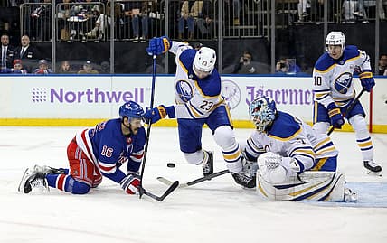 Nov 27, 2023; New York, New York, USA; Buffalo Sabres goalie Ukko-Pekka Luukkonen (1) makes a save as New York Rangers center Vincent Trocheck (16) and Buffalo Sabres defenseman Mattias Samuelsson (23) battle for the puck during the second period at Madison Square Garden. Mandatory Credit: Danny Wild-USA TODAY Sports