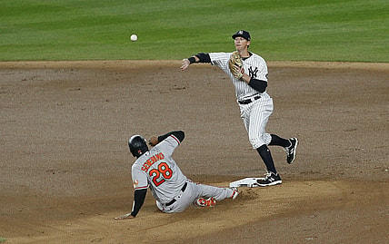 Apr 5, 2021; Bronx, New York, USA; Baltimore Orioles catcher Pedro Severino (28) is forced out at second base by New York Yankees second baseman DJ LeMahieu (right) during the fifth inning at Yankee Stadium. Mandatory Credit: Andy Marlin-USA TODAY Sports