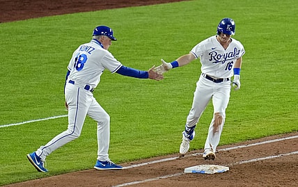 Jun 1, 2021; Kansas City, Missouri, USA; Kansas City Royals left fielder Andrew Benintendi (16) is congratulated by first base coach Rusty Kuntz (18) after hitting a grand slam against the Pittsburgh Pirates during the fifth inning at Kauffman Stadium. Mandatory Credit: Jay Biggerstaff-USA TODAY Sports