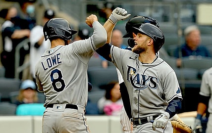 Jun 3, 2021; Bronx, New York, USA; Tampa Bay Rays designated hitter Austin Meadows (17) is congratulated by  second baseman Brandon Lowe (8) after hitting a two run home run against the New York Yankees during the fourth inning at Yankee Stadium. Mandatory Credit: Andy Marlin-USA TODAY Sports