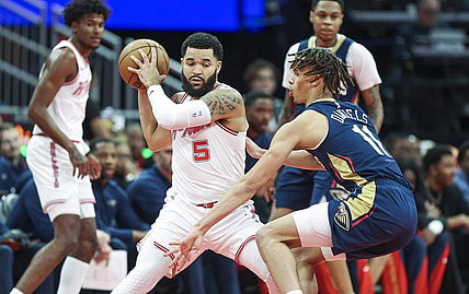Nov 10, 2023; Houston, Texas, USA; Houston Rockets guard Fred VanVleet (5) controls the ball as New Orleans Pelicans guard Dyson Daniels (11) defends during the first quarter at Toyota Center. Mandatory Credit: Troy Taormina-USA TODAY Sports