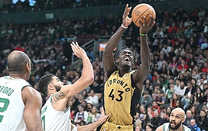 Nov 17, 2023; Toronto, Ontario, CAN;   Toronto Raptors forward Pascal Siakam (43) shoots the ball over Boston Celtics forward Jayson Tatum (0) in the second half at Scotiabank Arena. Mandatory Credit: Dan Hamilton-USA TODAY Sports