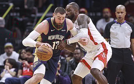 Jan 31, 2024; Houston, Texas, USA; New Orleans Pelicans center Jonas Valanciunas (17) controls the ball as Houston Rockets forward Jeff Green (32) defends during the fourth quarter at Toyota Center. Mandatory Credit: Troy Taormina-USA TODAY Sports