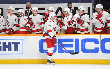 Jan 18, 2021; Nashville, Tennessee, USA; Carolina Hurricanes right wing Sebastian Aho (20) is congratulated by teammates after a goal during the third period against the Nashville Predators at Bridgestone Arena. Mandatory Credit: Christopher Hanewinckel-USA TODAY Sports