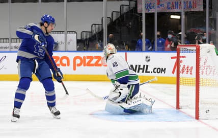 Feb 6, 2021; Toronto, Ontario, CAN; Toronto Maple Leafs forward Auston Matthews (34) scores against Vancouver Canucks goalie Braden Holtby (49) in the third period at Scotiabank Arena. Mandatory Credit: Dan Hamilton-USA TODAY Sports