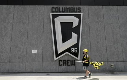 Nick Auddino, of Westerville, walks in front of a Columbus Crew logo on the west side of Lower.com Field before attending the inaugural match between the Columbus Crew and the New England Revolution in Columbus on Saturday, June 1, 2021. Auddino is a longtime Crew supporter who has only missed one game for the birth of his son. His children Jordan, 12, and Laina, 6, Auddino, were attending the match with him.

01 fans