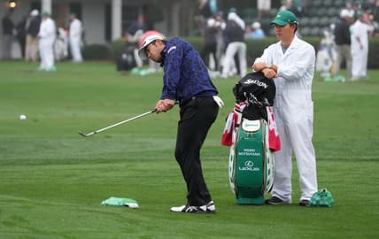 Apr 6, 2022; Augusta, Georgia, USA; Hideki Matsuyama chips balls at the practice facility during a practice round of The Masters golf tournament at Augusta National Golf Club. Mandatory Credit: Kyle Terada-USA TODAY Sports