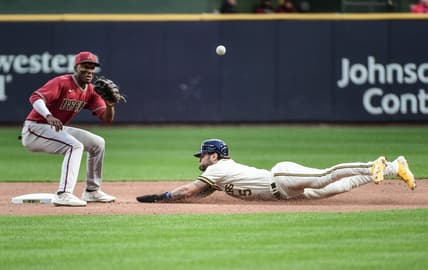 Oct 5, 2022; Milwaukee, Wisconsin, USA;  Milwaukee Brewers center fielder Garrett Mitchell (5) steals second base as Arizona Diamondbacks shortstop Geraldo Perdomo (2) waits for the ball in the second inning at American Family Field. Mandatory Credit: Benny Sieu-USA TODAY Sports