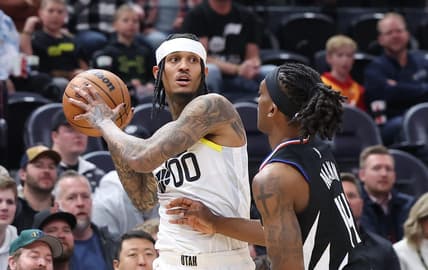 Nov 30, 2022; Salt Lake City, Utah, USA; Utah Jazz guard Jordan Clarkson (00) looks to pass the ball against Los Angeles Clippers guard Terance Mann (14) in the first quarter at Vivint Arena. Mandatory Credit: Rob Gray-USA TODAY Sports