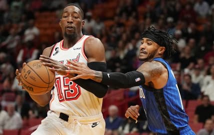 Jan 27, 2023; Miami, Florida, USA; Orlando Magic guard Gary Harris (14) defends Miami Heat center Bam Adebayo (13) during the first half at Miami-Dade Arena. Mandatory Credit: Jim Rassol-USA TODAY Sports